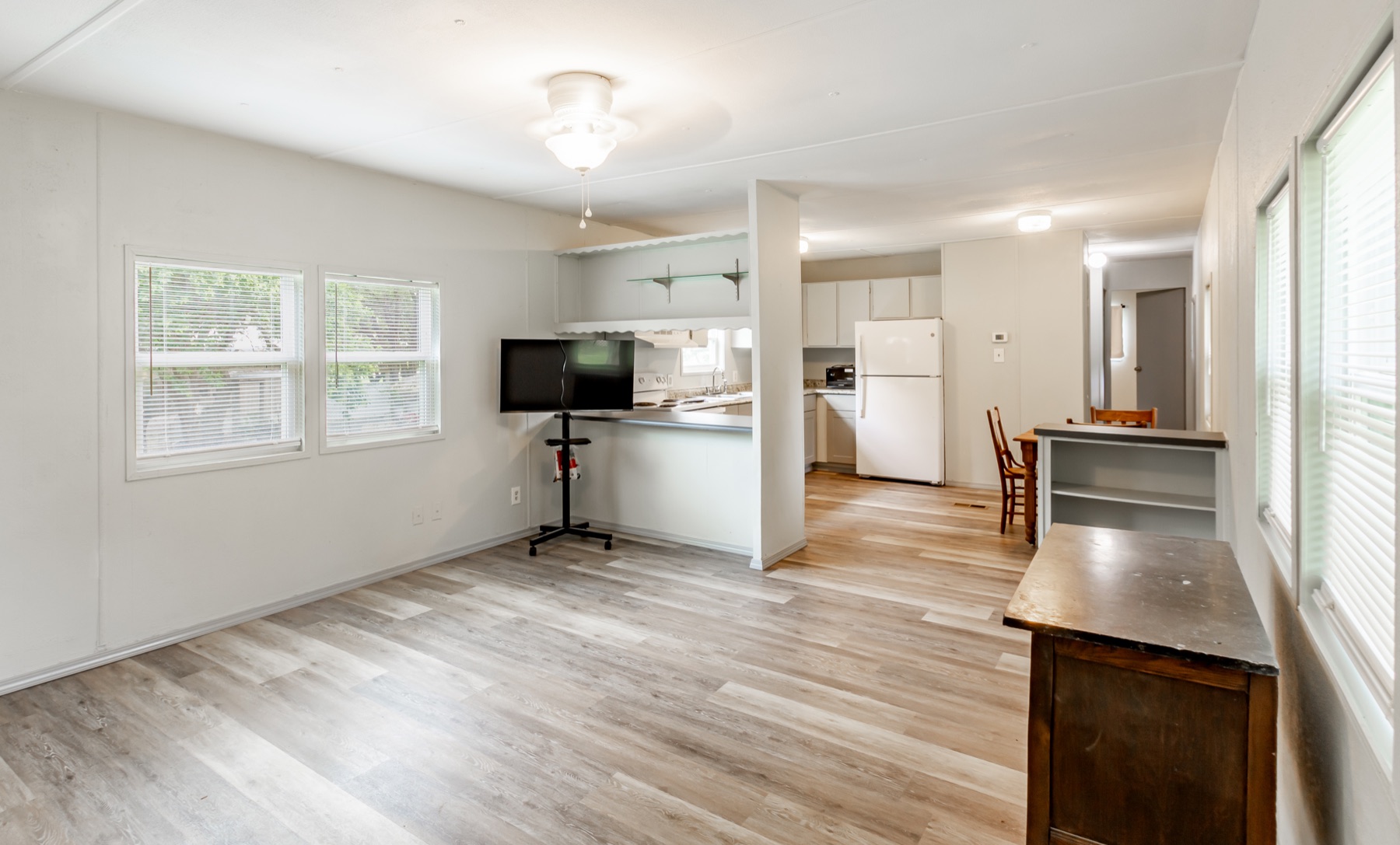 Bright updated living room and eat-in kitchen at 1139 Hidden Fawn in Canyon Lake, Texas