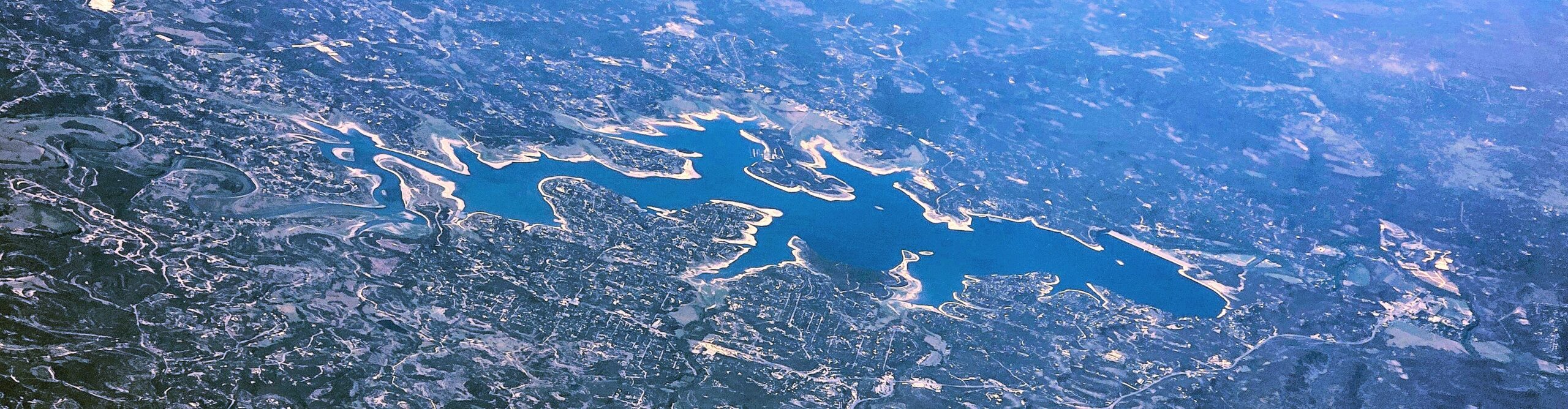 Real aerial photograph of Canyon Lake, Texas, showing the branching reservoir and protected shoreline
